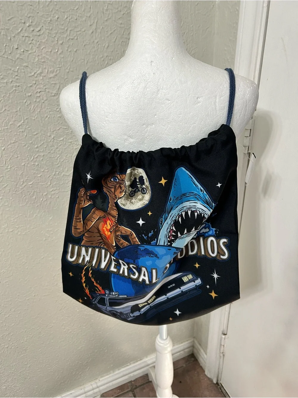 Universal Black Drawstring Backpack with Blue and Multicolor Movie Graphics